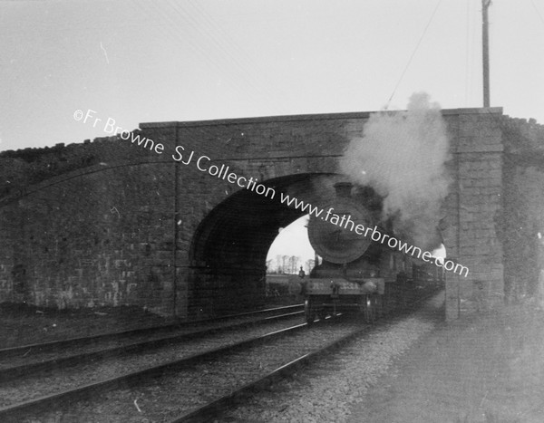 SMOKY LOCO EMERGES FROM UNDER BRIDGE